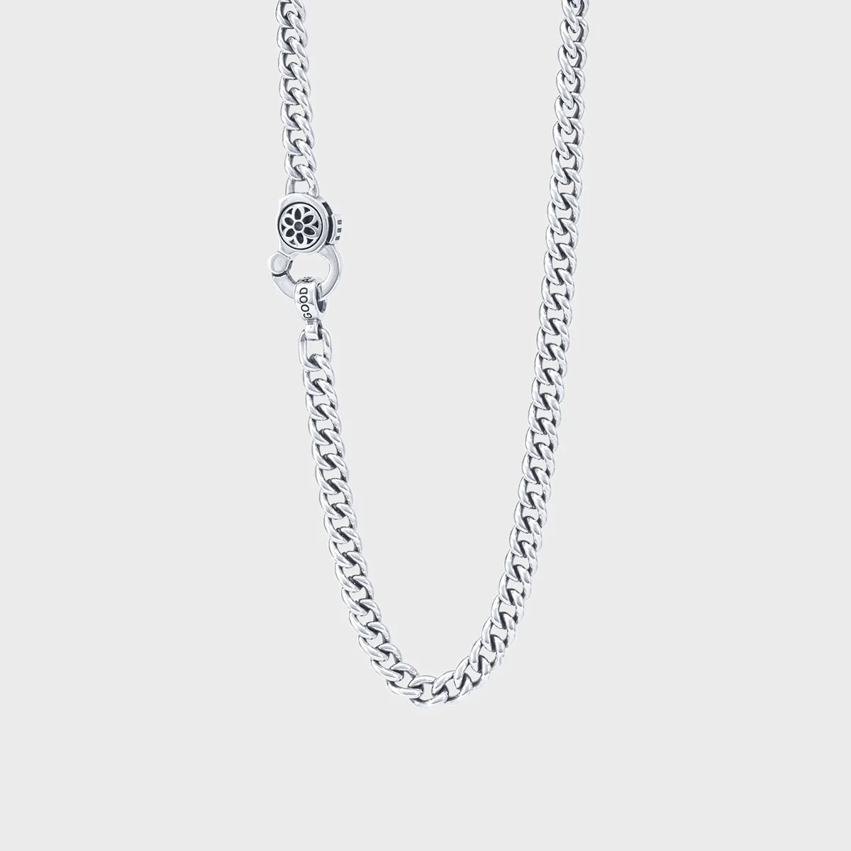 Sterling silver curb chain necklace with engraved clasp and detailed flower design on toggle clasp