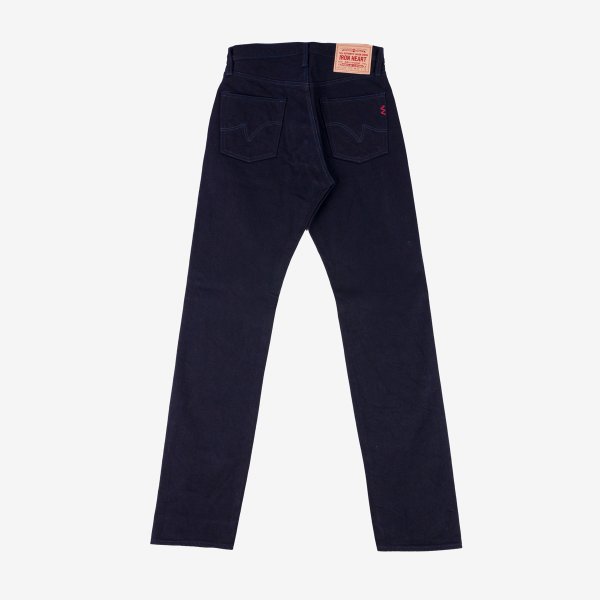 Dark navy Iron Heart heavyweight denim jeans laid flat showing back pockets, leather patch, and stitching detail