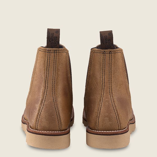Rear view of brown leather ankle boots with pull tabs and light rubber soles from Iron Shop Provisions